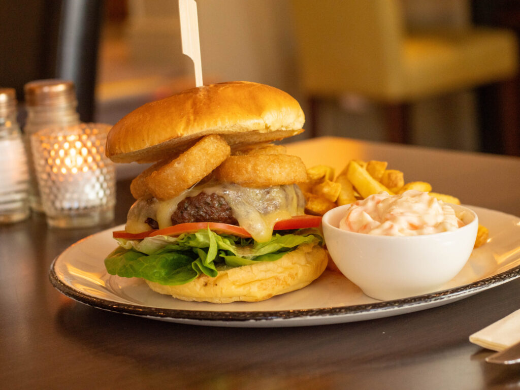 burger with chips and onion rings